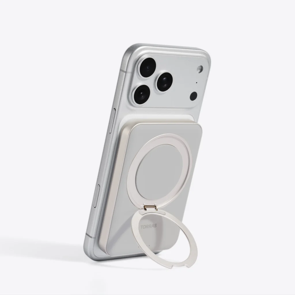 Torus magnetic power bank attached to the back of an iPhone
